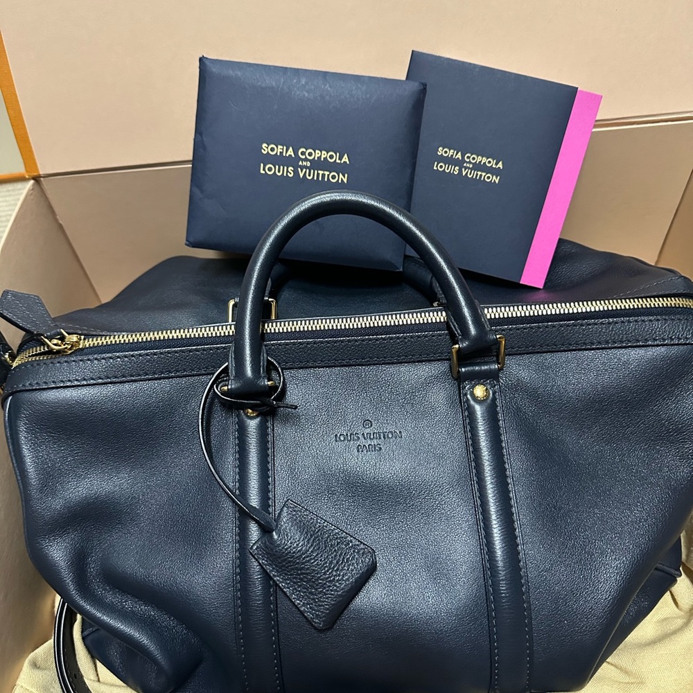 Louis Vuitton Dark Blue Leather Bag with Gold Accents Like new .Limited edision